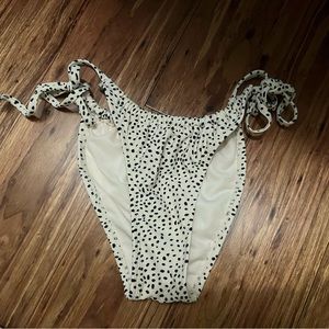 tan and black patterned string bikini bottoms